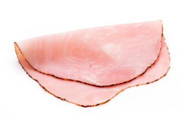 Thin slices of ham on white background.