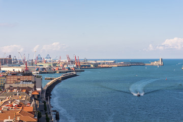 Up on the Vizcaya Bridge, a transporter bridge that links the towns of Portugalete and Las Arenas close to Bilbao. Look to the north with the estuary of Bilbao and the deep sea harbor