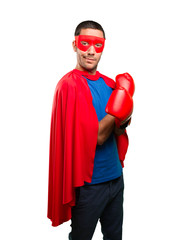 Surprised superhero with a boxing gloves