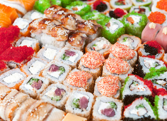 Sushi net on a black surface. Flat lay