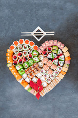 Sushi net on a black surface. Flat lay