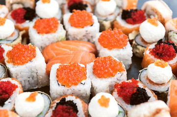 Sushi net on a black surface. Flat lay