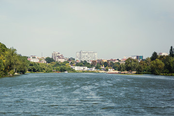 Beautiful summer landscape with river Southern Bug and blue sky in Vinnitsa, Ukraine. Calm summer day on river,sunny image.River on background of trees and sky.river and forest