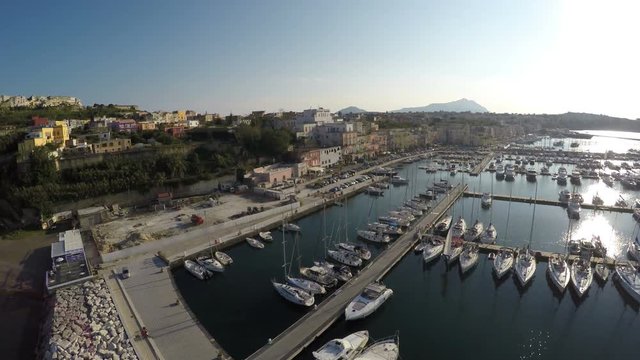 Top view of many boats moored at Marina Grande on Procida Island, luxury hobby