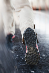 Young man run on the station platform with backpack on train station