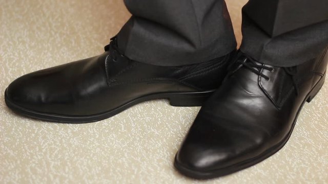 Man ticking a step in office shoes