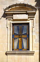 Fototapeta na wymiar Stained glass window depicting a Maltese cross. Rabat. Malta