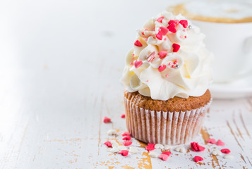 Cupcakes with vanilla frosting and hearts