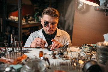 Watchmaker repair old clocks gear