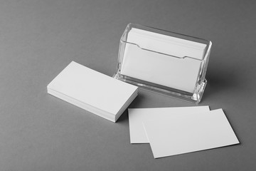 Blank business cards on grey background - Powered by Adobe