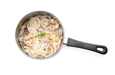 Chicken noodle soup in pan on white background