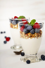 Freshly prepared yogurt parfait with fresh fruit and mint