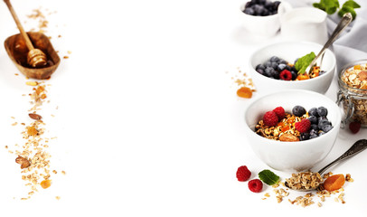 Healthy breakfast -  Homemade granola, honey, milk and berries