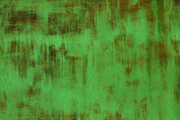 Old shabby dyed green rusty textured steel sheet metal