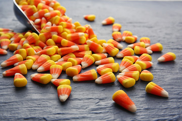 Tasty Halloween candies on dark background