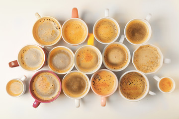 Obraz na płótnie Canvas Cups of coffee on white background