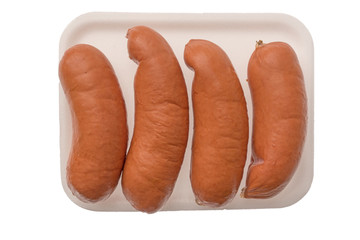 isolated plastic package with sausages on the white