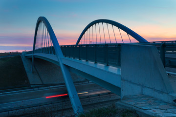 Fototapeta na wymiar modern bridge ovet the highway, evening light,Nitra, Slovakia