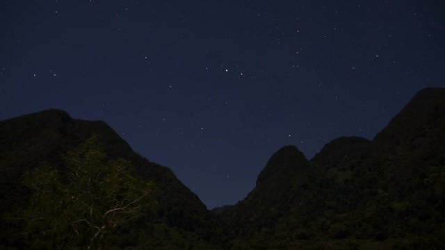 Starry Night Time Lapse over mountain range 