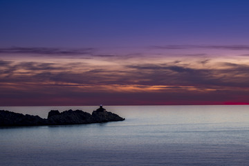 Fototapeta na wymiar Lighthouse in sunset; island Grebeni, Dubrovnik, Croatia