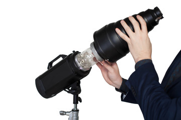 Fototapeta premium Photographer hands adjusts the lighting in studio