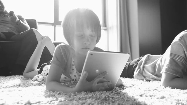 kids playing on floor of modern apartment
