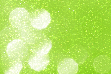 Fototapeta na wymiar Green abstract Spring background. Bokeh or round defocused particles or glitter lights
