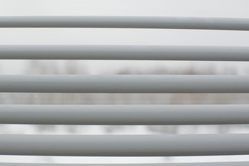 White horizontal blinds on window, close-up