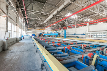 workshop for the production of aluminum profiles. conveyor with aluminum profiles