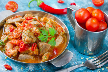 Canned stewed pork meat in sauce