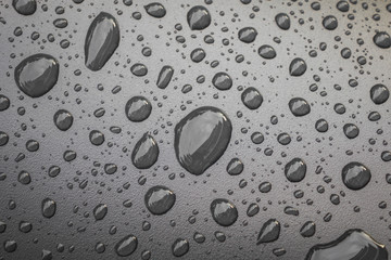 Water drops on black blackground .