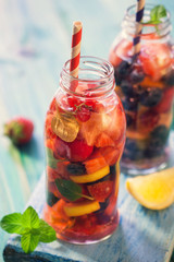Infused water with fresh berry fruits,lemon, orange and Mint