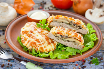 Veal Prince Orloff or French meat - veal chops with mushrooms tomatoes onion cheese and mayonnaise