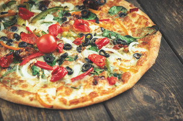 Delicious fresh pizza served on wooden table