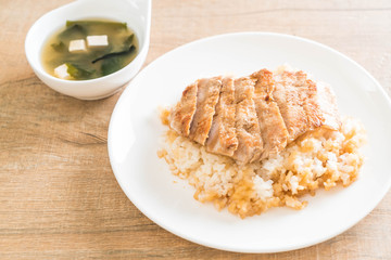 teriyaki pork on topped rice with miso soup