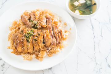 teriyaki chicken on topped rice with miso soup