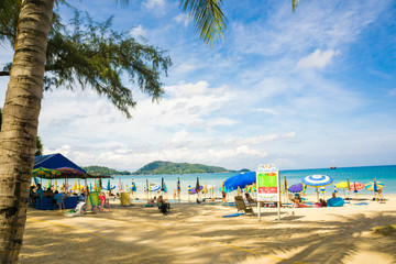 Sea beach with people relaxation and colorful of umbrella