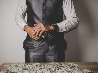 Money and power, Senior gangster with gun, in suit at the table.