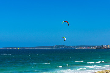 People kite surfing in the ocean