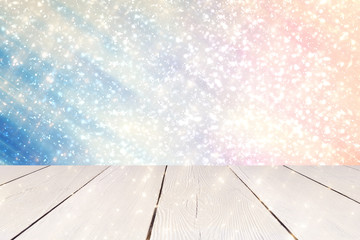 White Table and Christmas abstract blue with red sun background with light and glitter bokeh