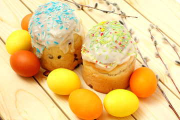 Easter Cake with painted eggs - Russian and Ukrainian Traditional Kulich, Paska Easter Bread on wood background