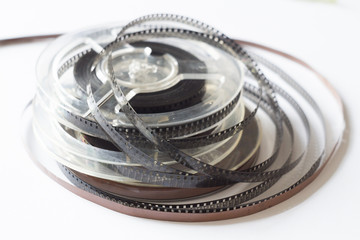 Naklejka premium Old reels with black and white film and magnetic tape