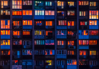 Reflection of sunset in the windows of houses.