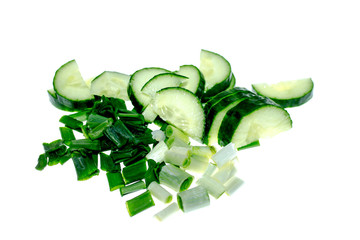 Green onion and cucumber sliced ​​on white background