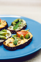 Sandwich with tomato, sunflower seeds, avocado, arugula. Fresh and healthy breakfast. Dietary food is prepared at home. Raw.