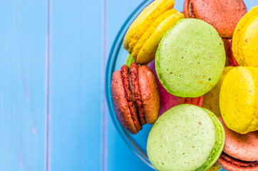 Still life with cup of tea and sweets on the wooden background