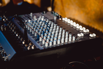 DJ console close-up. Sound technician equipment.