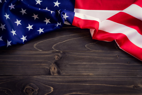 USA flag on wooden wall background and texture with space