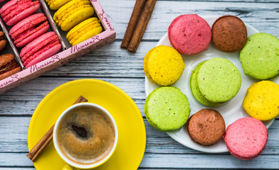 Still life with cup of tea and sweets on the wooden background