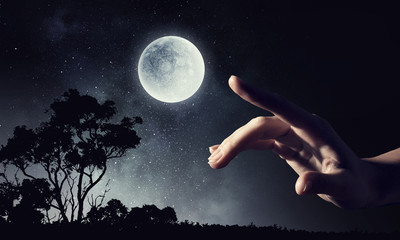 Moon planet in hand